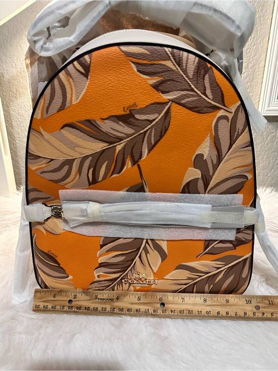 coach backpack orange Women's Turnlock Honey Brown One Size : Clothing, Shoes & Jewelry Signature coated canvas and refined pebble leather Inside zip and multifunction pockets Double zip closure fabric lining Handle with 1 1/2 drop Outside zip and open pockets Adjustable shoulder straps 8 (L) x 9 (H) x 3 1/2 (W) Style No. Convertible Backpack Orange Coach Leather